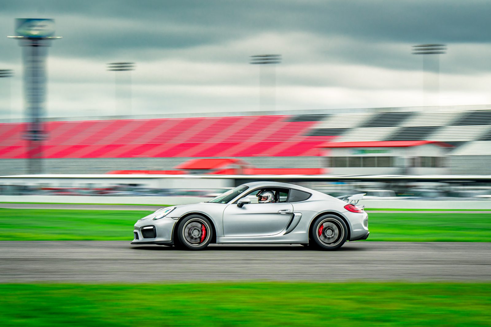Porsche Cayman 718 GT4 panning through a corner at speed